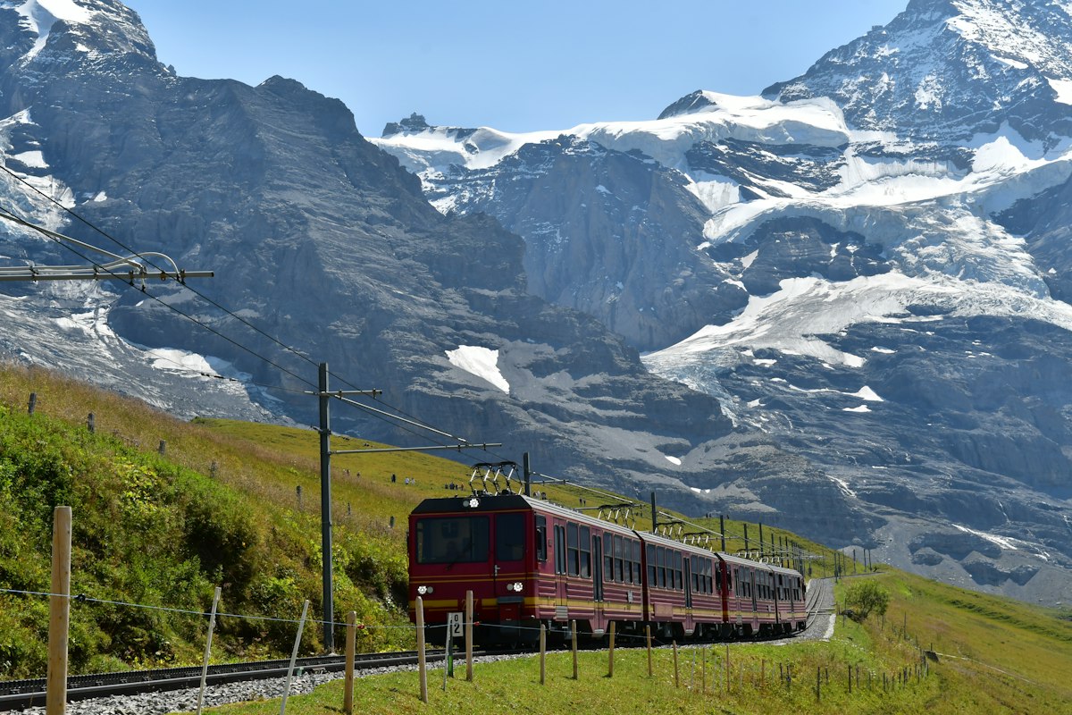 The Jungfrau Railway climbing below the Jungfrau and its glaciers, Switzerland